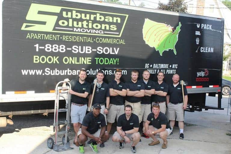 Philadelphia moving team posing in front of the truck
