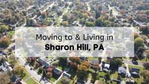 Aerial view of suburban homes and tree-lined streets in suburban Pennsylvania, showing neatly arranged houses, green lawns, and fall foliage throughout the neighborhood.
